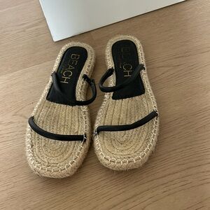 Espadrille flat black sandals with woven sole